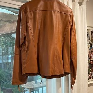Brand new leather jacket never worn. No tags. Adorable fit!